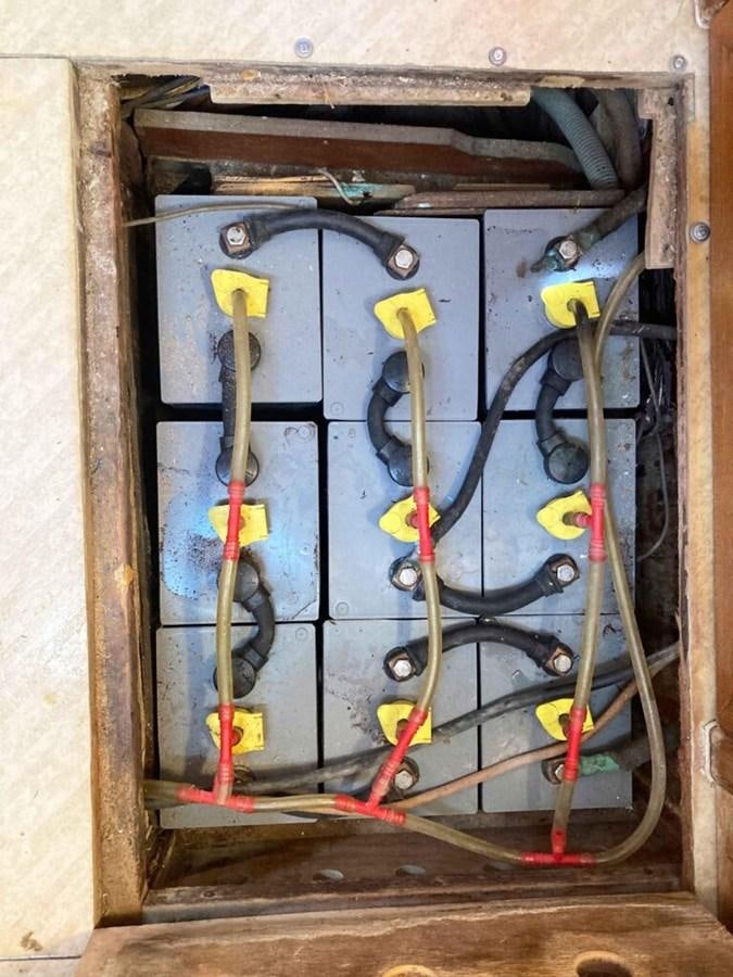 a group of colorful wires in a metal box aboard CONAN Yacht for Sale
