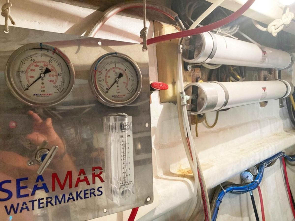 a few clocks on a wall aboard CONAN Yacht for Sale