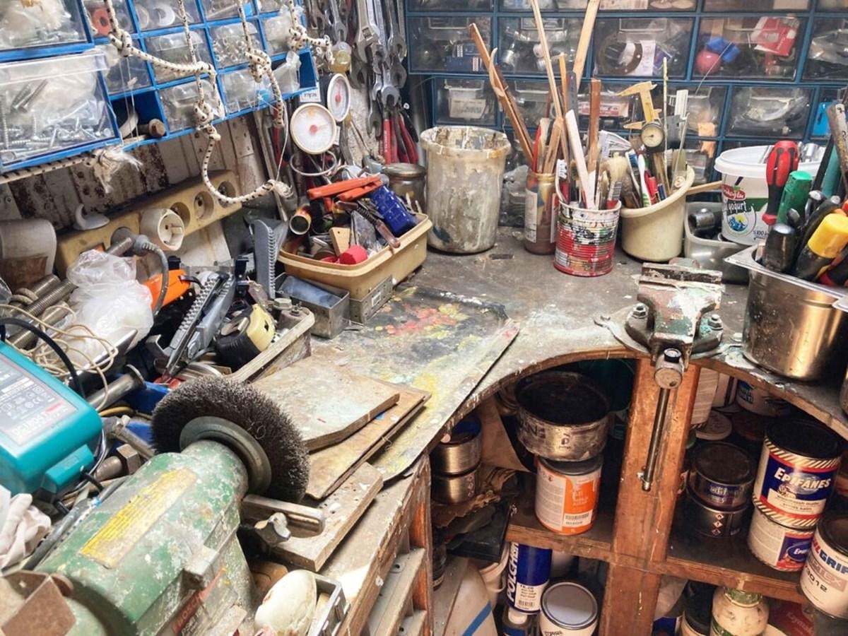 a room full of clutter aboard CONAN Yacht for Sale