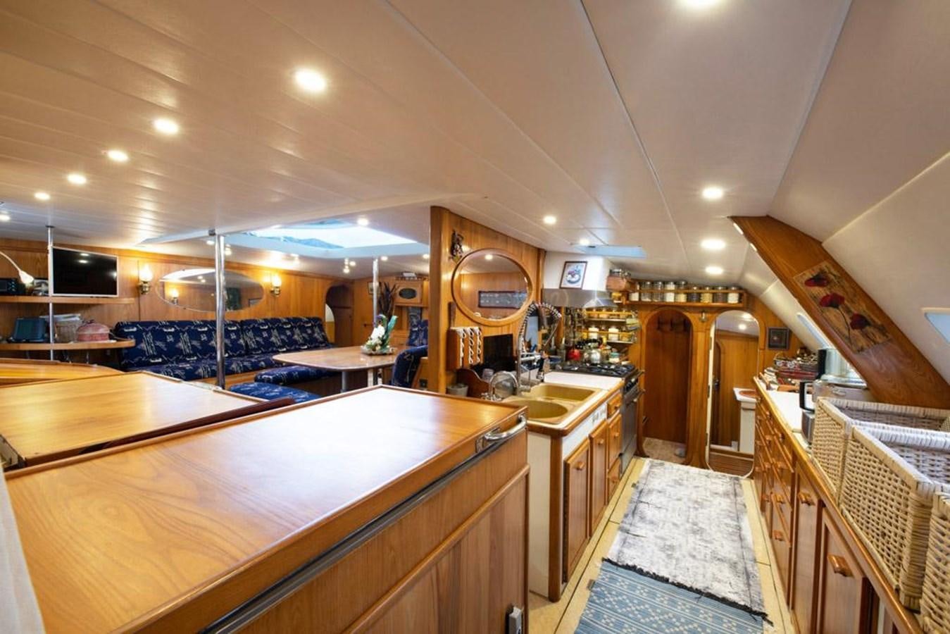 a kitchen with a bar and a bar aboard CONAN Yacht for Sale