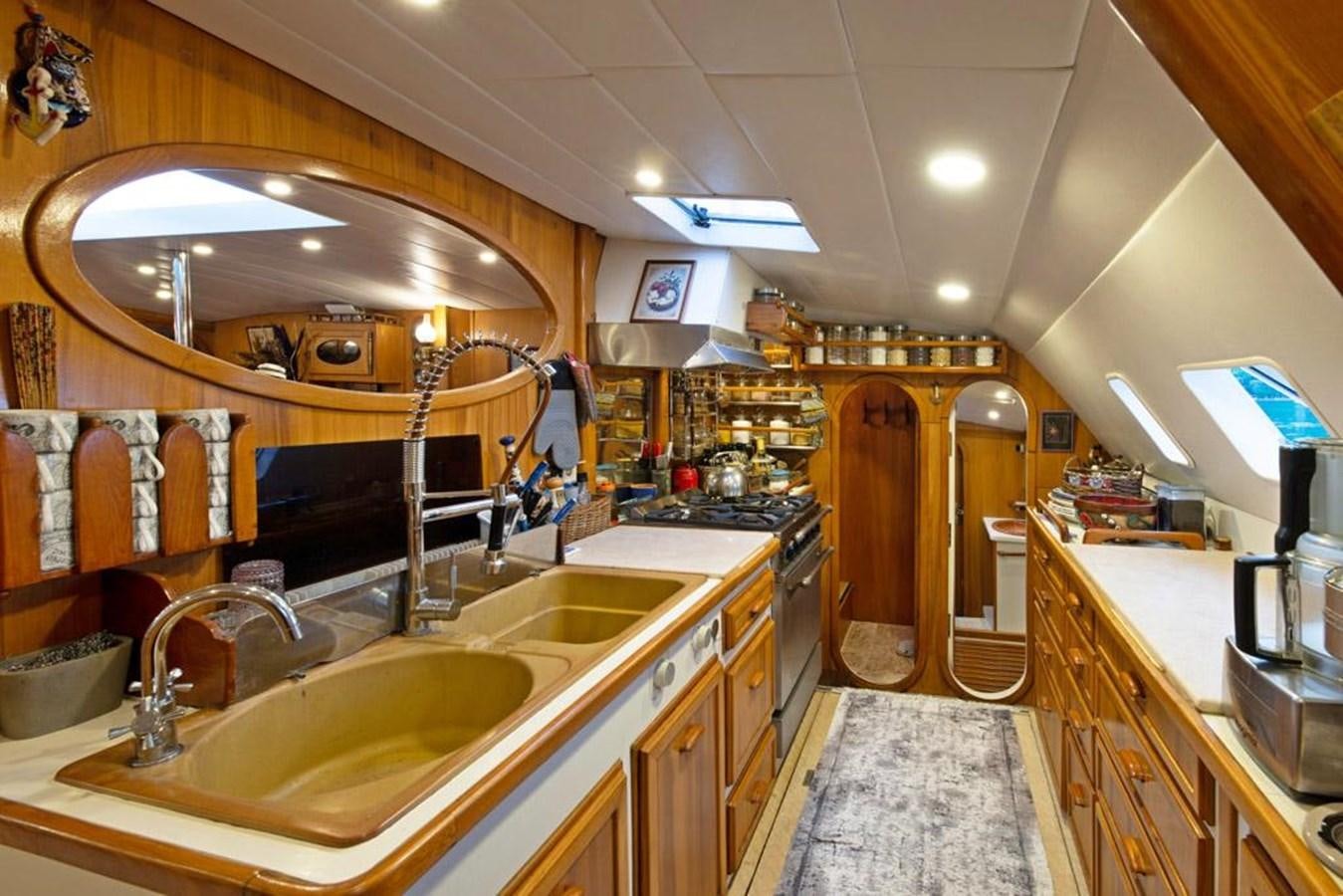 a kitchen with a large sink aboard CONAN Yacht for Sale