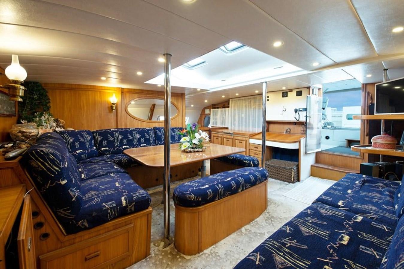 a living room with a pool table aboard CONAN Yacht for Sale