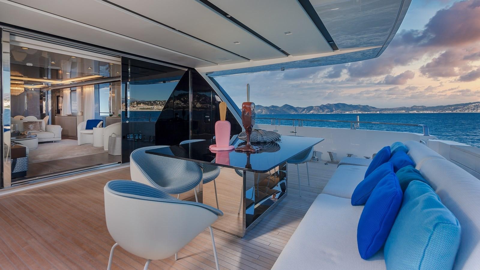 a room with a table and chairs aboard SL118 #653 Yacht for Sale