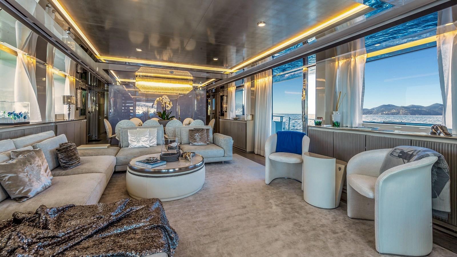 a living room with a large window aboard SL118 #653 Yacht for Sale