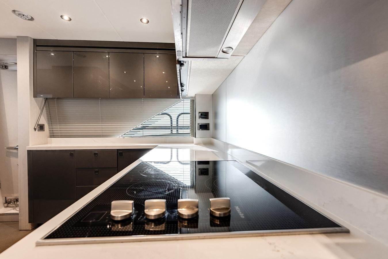 a kitchen with a countertop aboard TRIGGER HAPPY Yacht for Sale