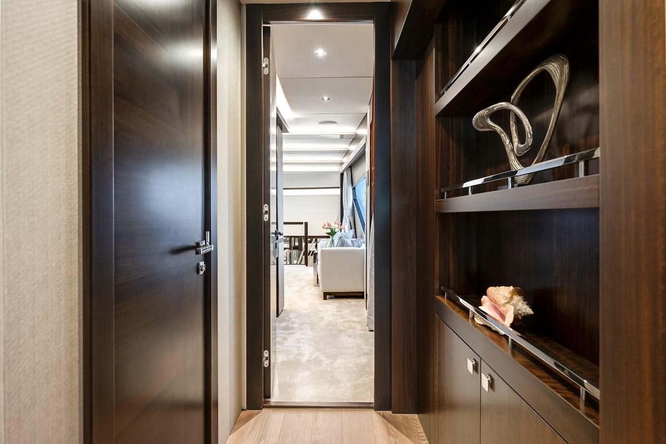 a room with a door and a mirror aboard TRIGGER HAPPY Yacht for Sale