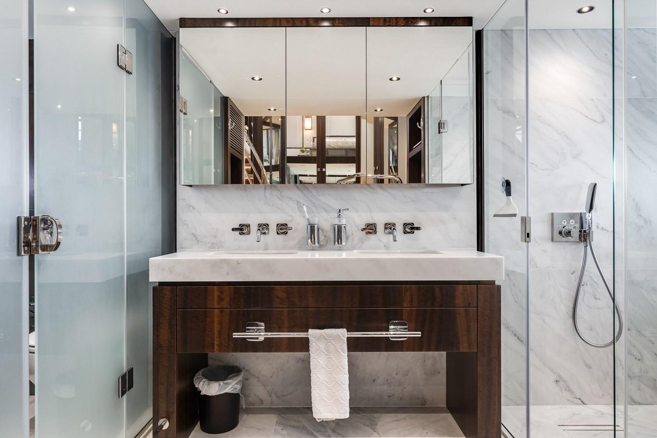 a bathroom with a large mirror aboard TRIGGER HAPPY Yacht for Sale