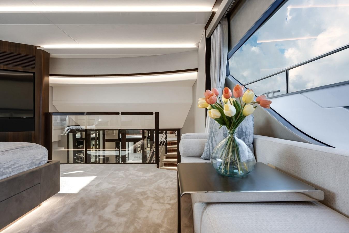 a vase of flowers on a table aboard TRIGGER HAPPY Yacht for Sale
