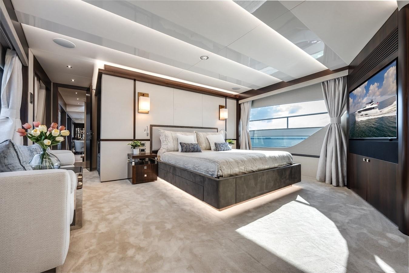 a large living room with a large window aboard TRIGGER HAPPY Yacht for Sale