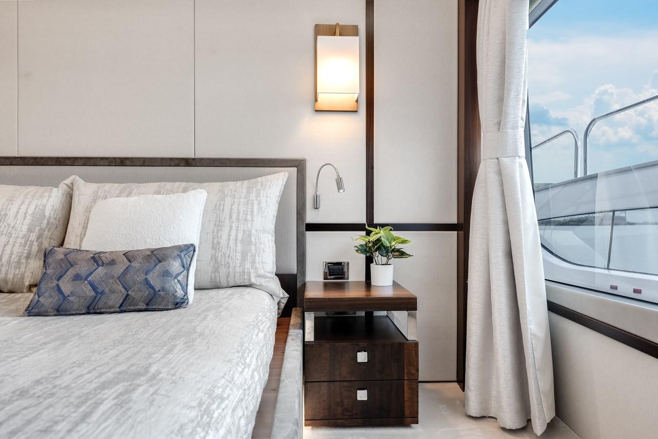 a bed with a white sheet aboard TRIGGER HAPPY Yacht for Sale