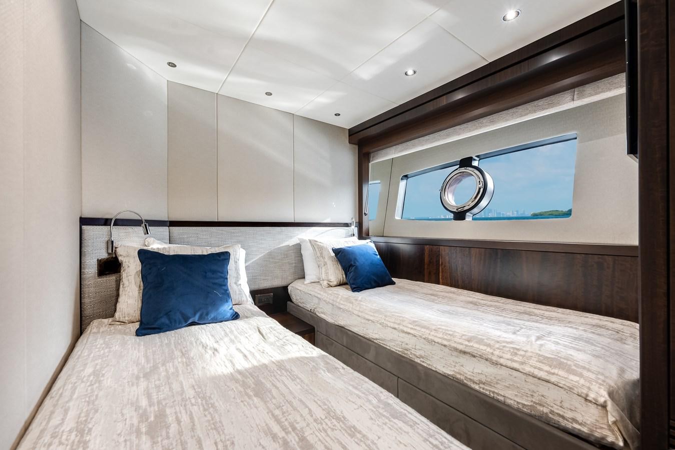 a room with two beds aboard TRIGGER HAPPY Yacht for Sale