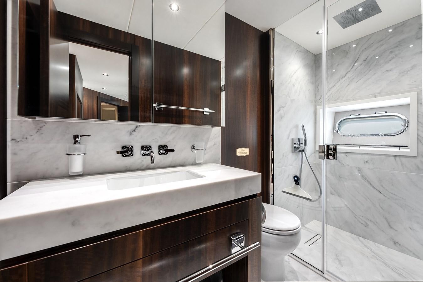 a bathroom with a sink and toilet aboard TRIGGER HAPPY Yacht for Sale
