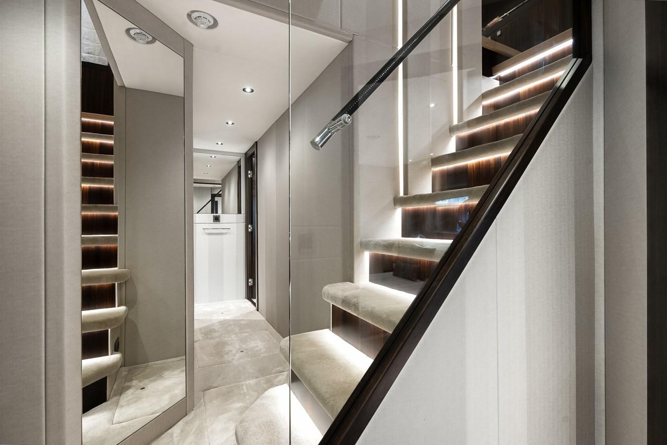 a hallway with white walls aboard TRIGGER HAPPY Yacht for Sale