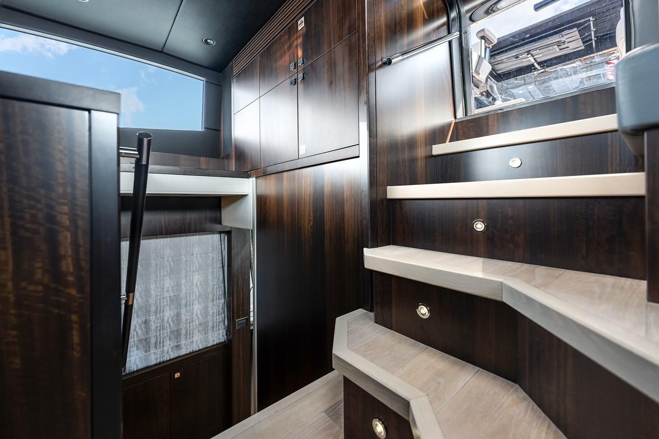 a room with wooden cabinets aboard TRIGGER HAPPY Yacht for Sale