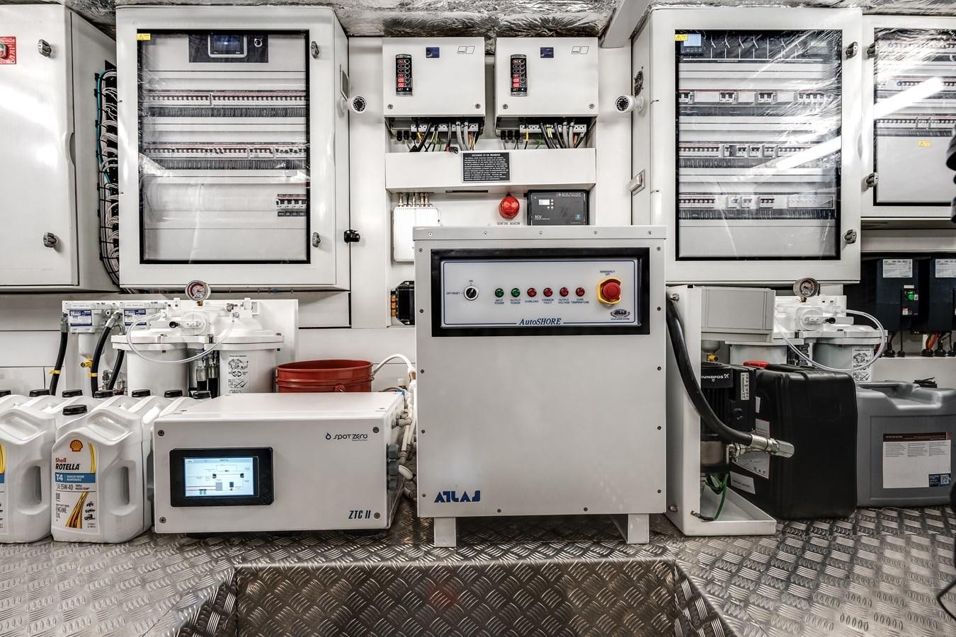 a kitchen with white appliances aboard TRIGGER HAPPY Yacht for Sale