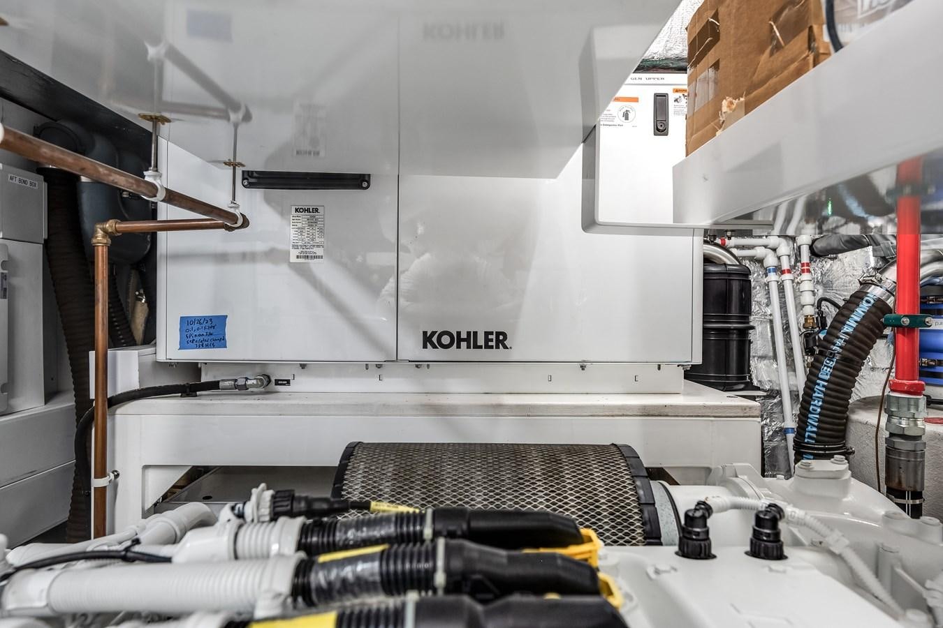 a machine with a piece of equipment aboard TRIGGER HAPPY Yacht for Sale