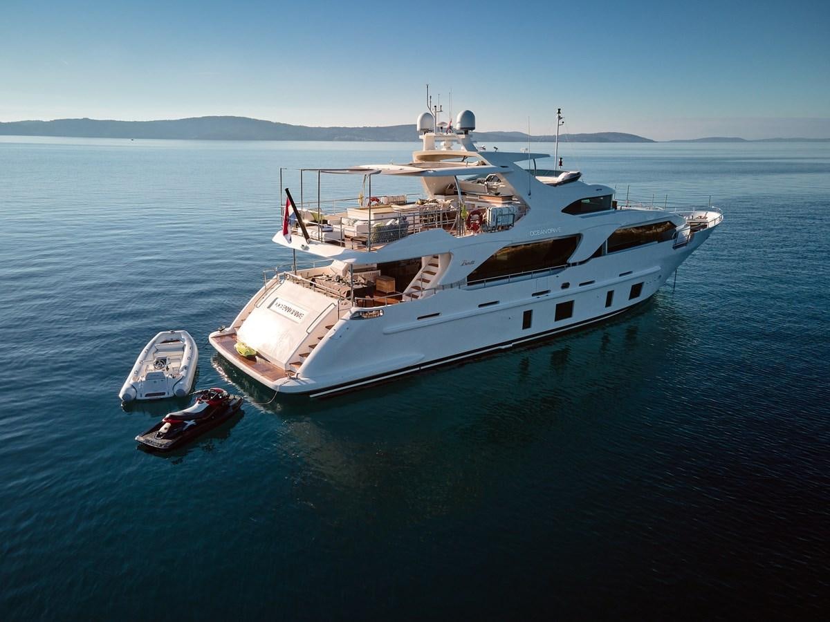 a large ship with a smaller boat on it aboard OCEAN DRIVE Yacht for Sale