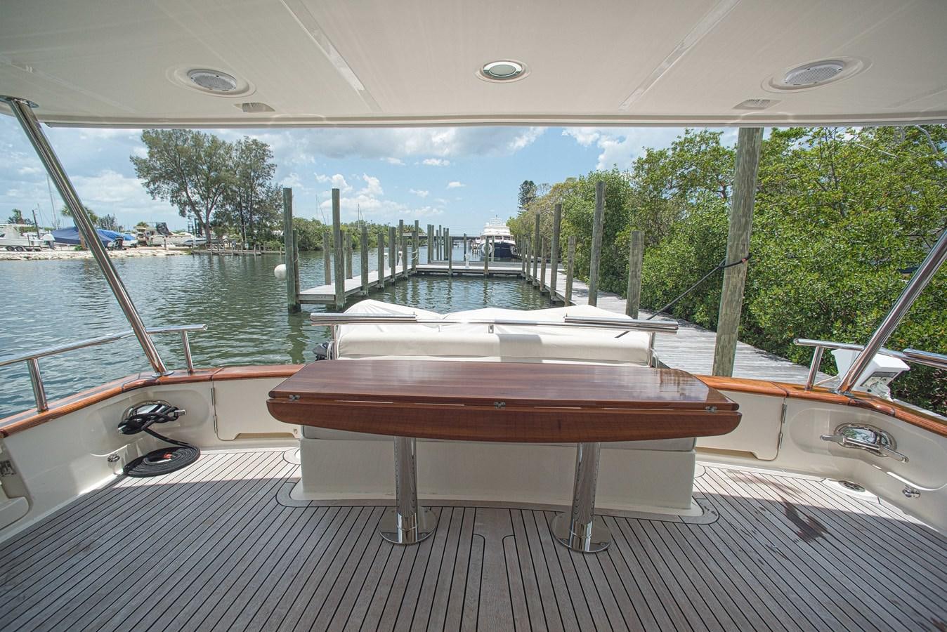a table and a sink in a room with a view of a body of water aboard TRUE NORTH Yacht for Sale