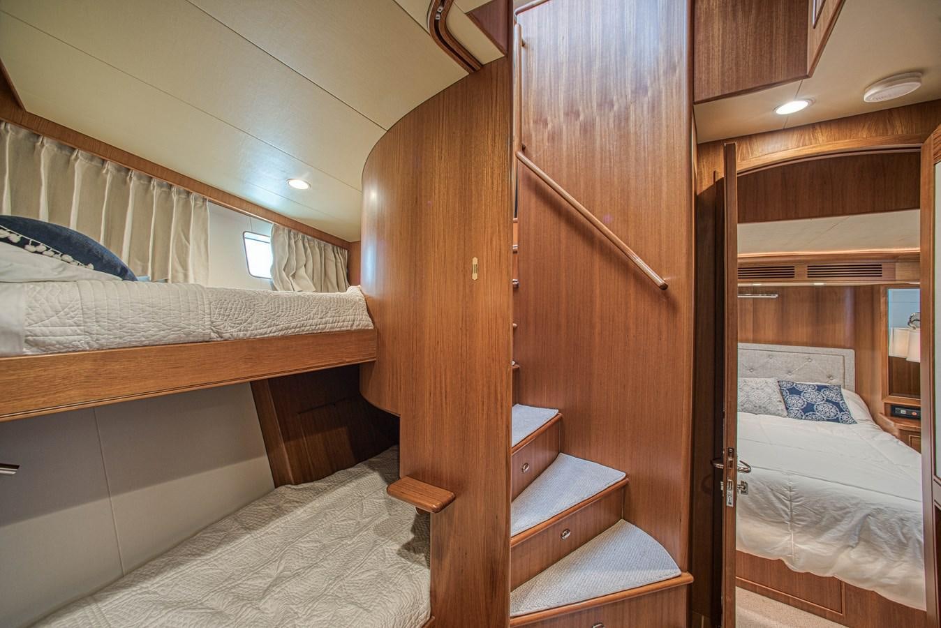a room with bunk beds aboard TRUE NORTH Yacht for Sale
