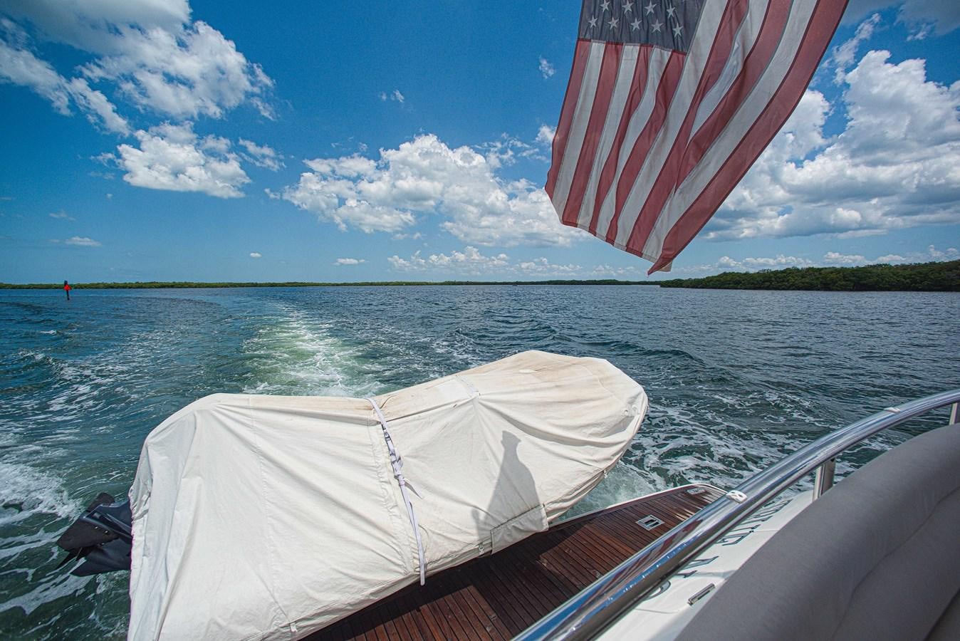 a flag on a boat aboard TRUE NORTH Yacht for Sale