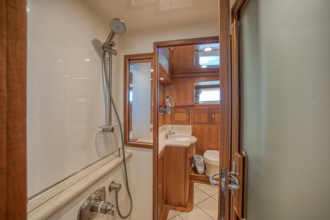 a bathroom with a sink and a mirror aboard TRUE NORTH Yacht for Sale