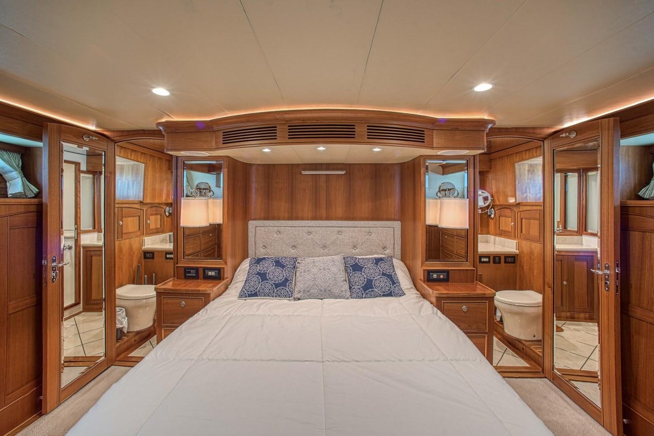a large bedroom with a large bed aboard TRUE NORTH Yacht for Sale