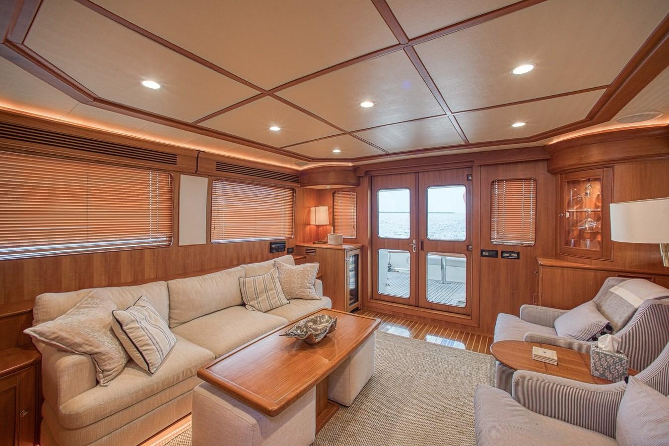 a living room with a couch and a table aboard TRUE NORTH Yacht for Sale