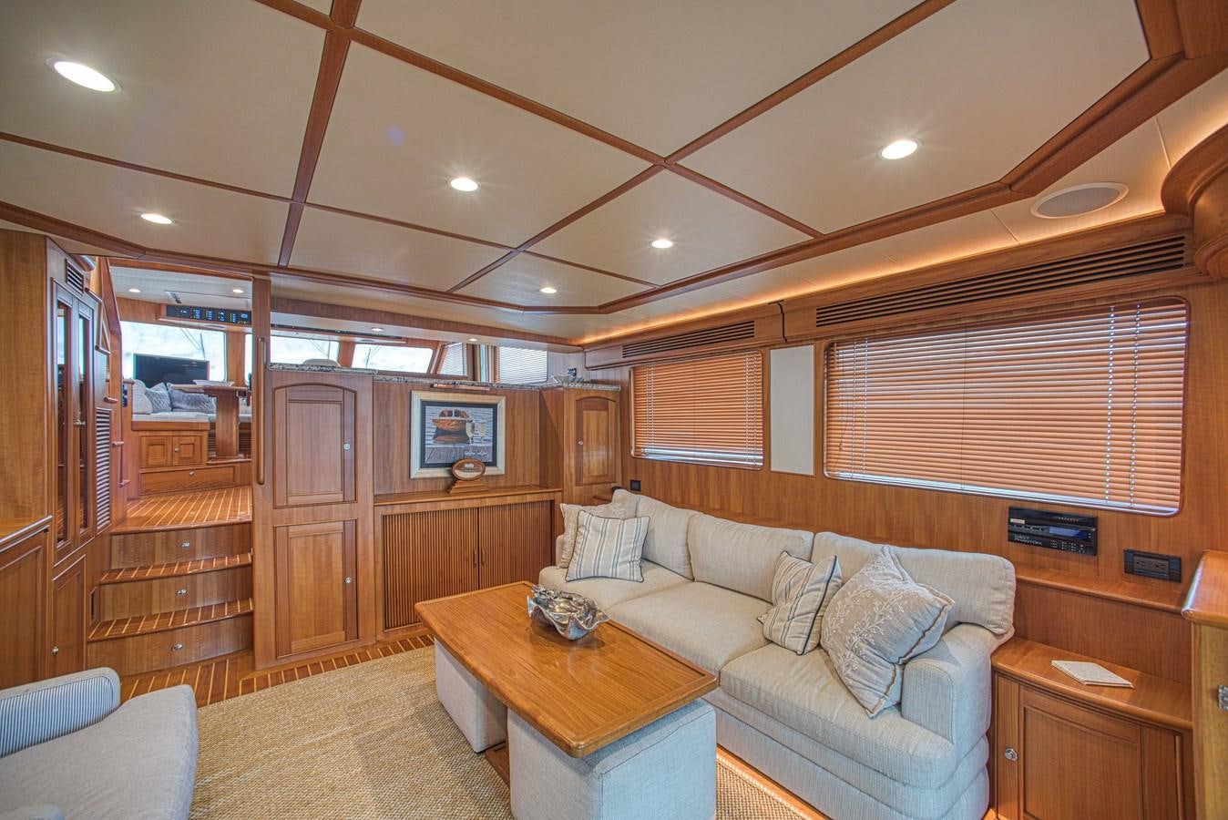 a living room with a couch and a table aboard TRUE NORTH Yacht for Sale