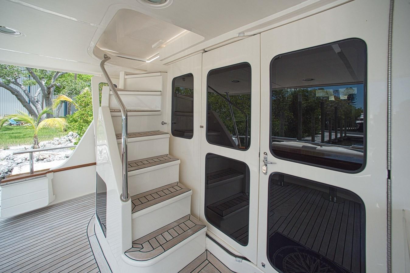 a white vehicle with a door open aboard TRUE NORTH Yacht for Sale