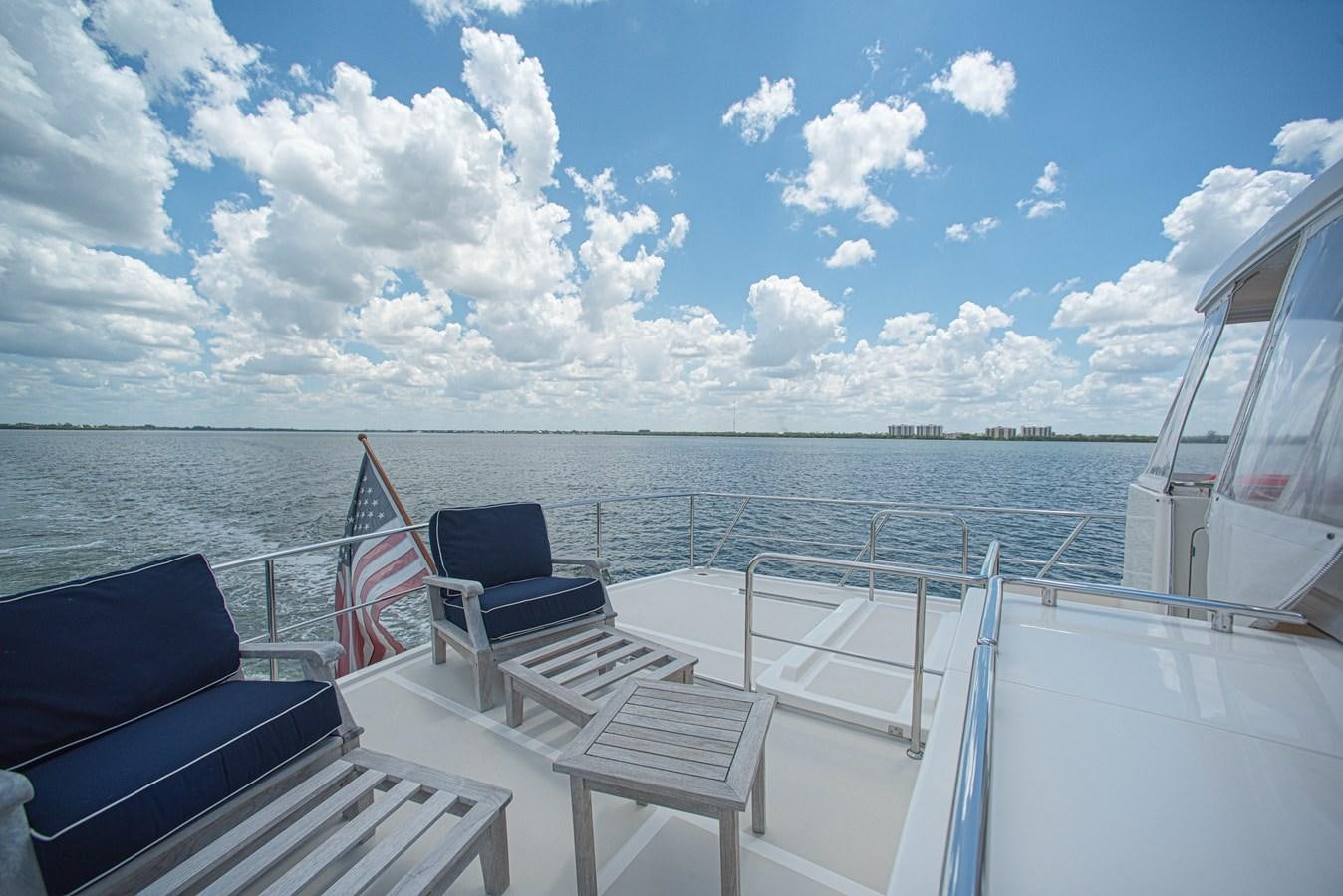 a boat with chairs on it aboard TRUE NORTH Yacht for Sale