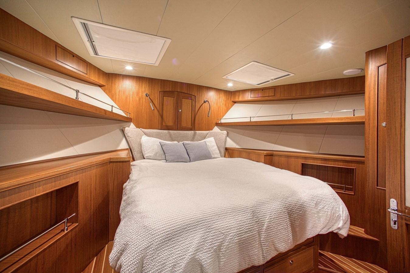a bed in a room aboard TRUE NORTH Yacht for Sale