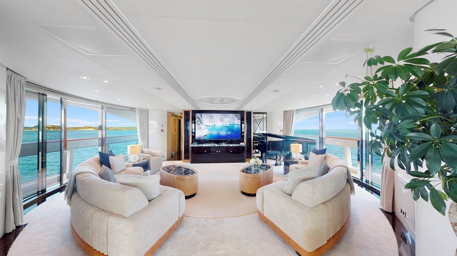 a living room with a large screen aboard AFTER YOU Yacht for Sale