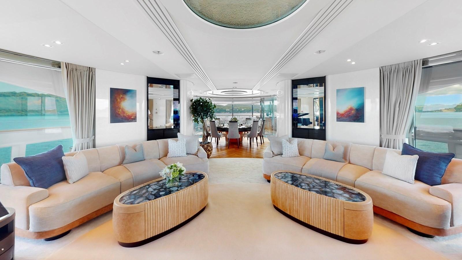 a living room with a couch and a table aboard AFTER YOU Yacht for Sale