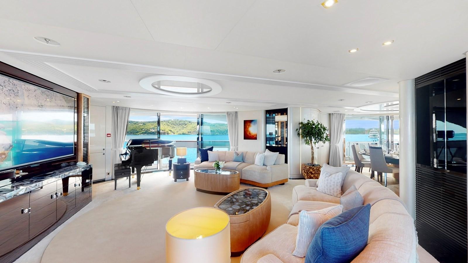 a living room with a large screen aboard AFTER YOU Yacht for Sale