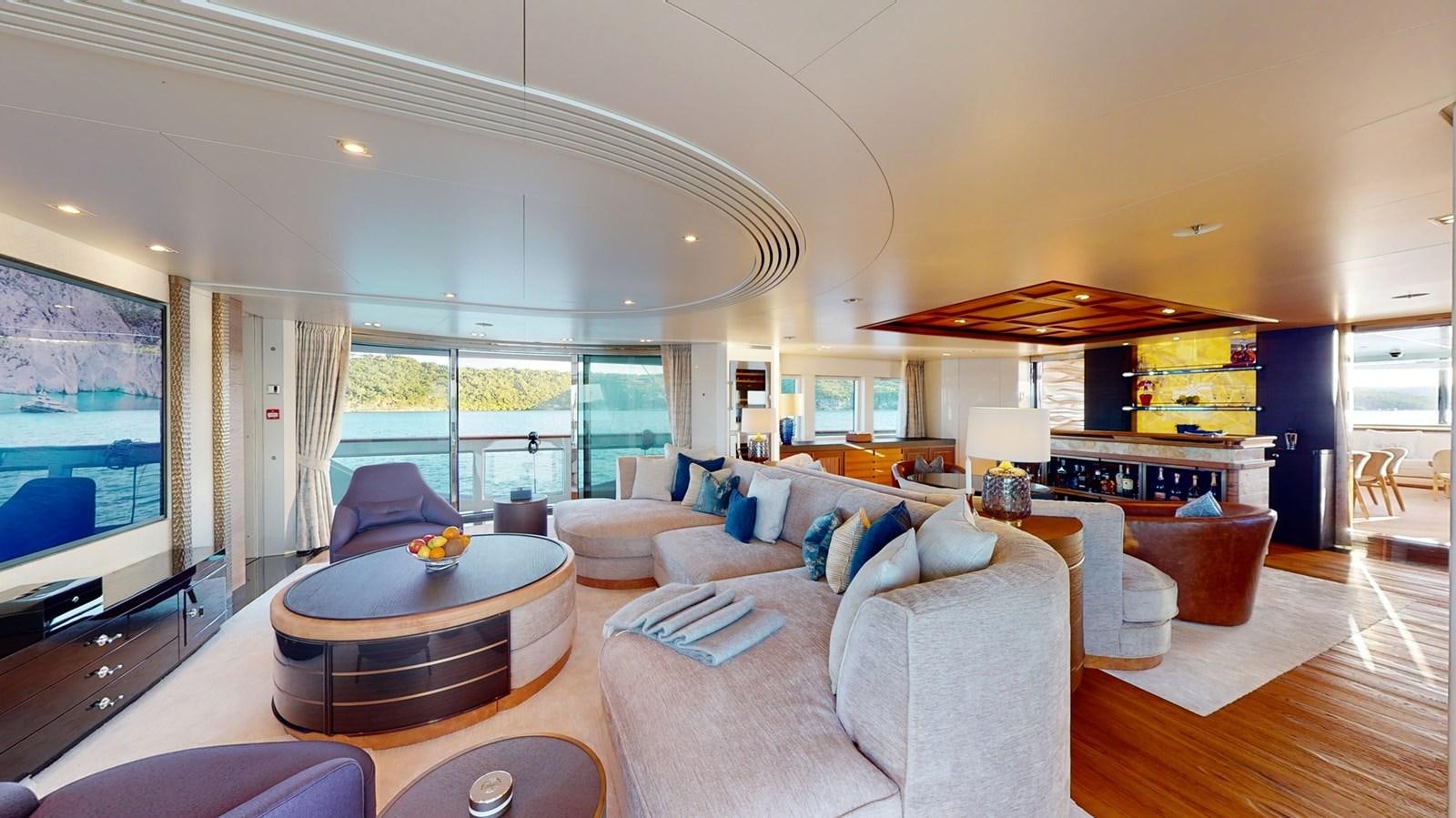 a living room with a large screen aboard AFTER YOU Yacht for Sale