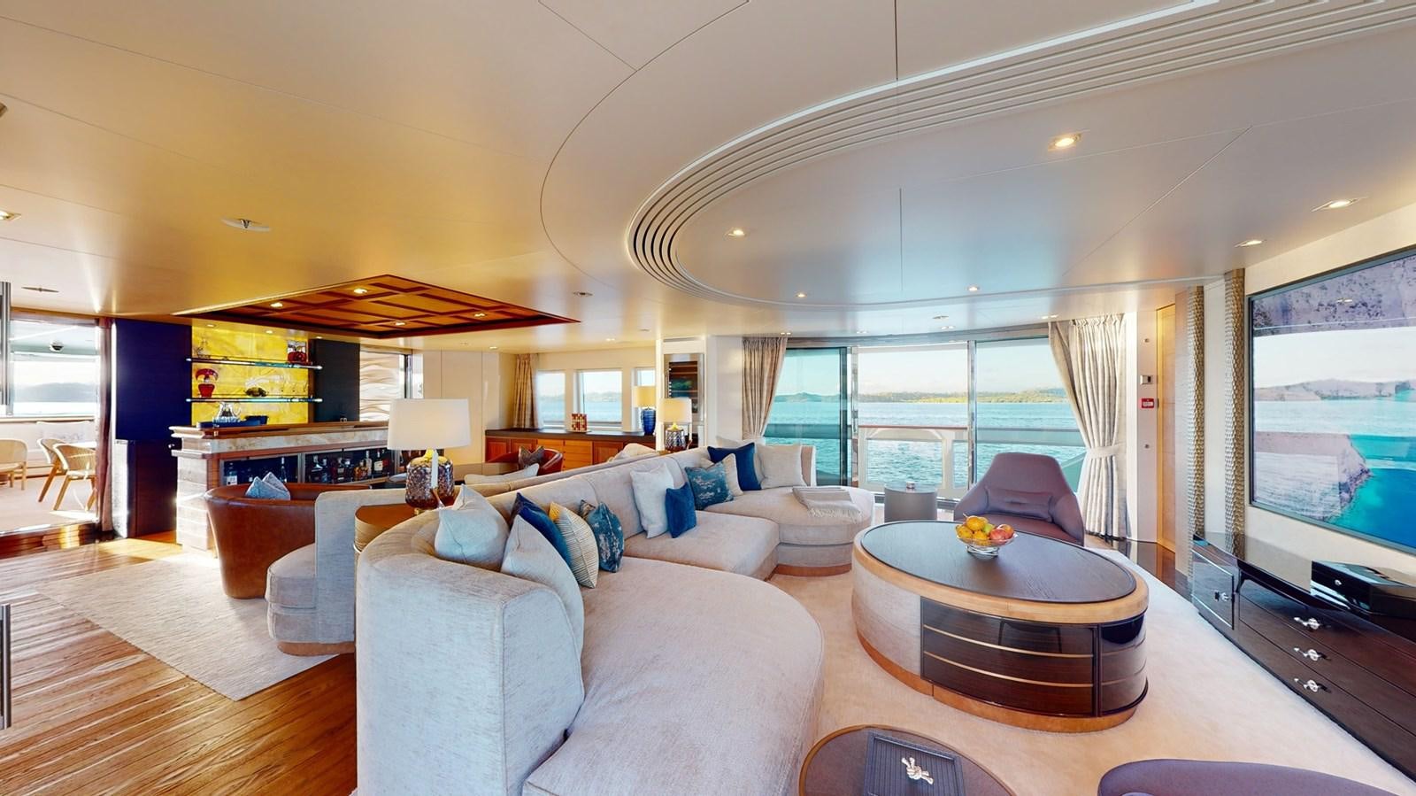 a living room with a large screen aboard AFTER YOU Yacht for Sale