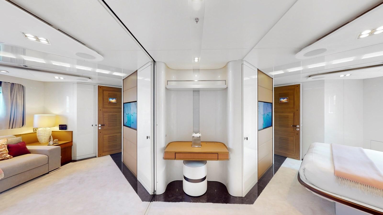 a room with a bed and a desk aboard AFTER YOU Yacht for Sale