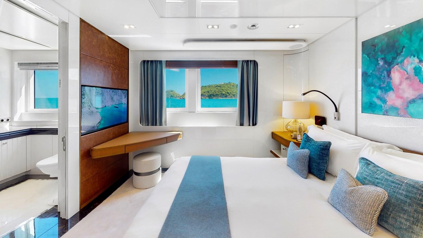a room with a bed and a tv aboard AFTER YOU Yacht for Sale