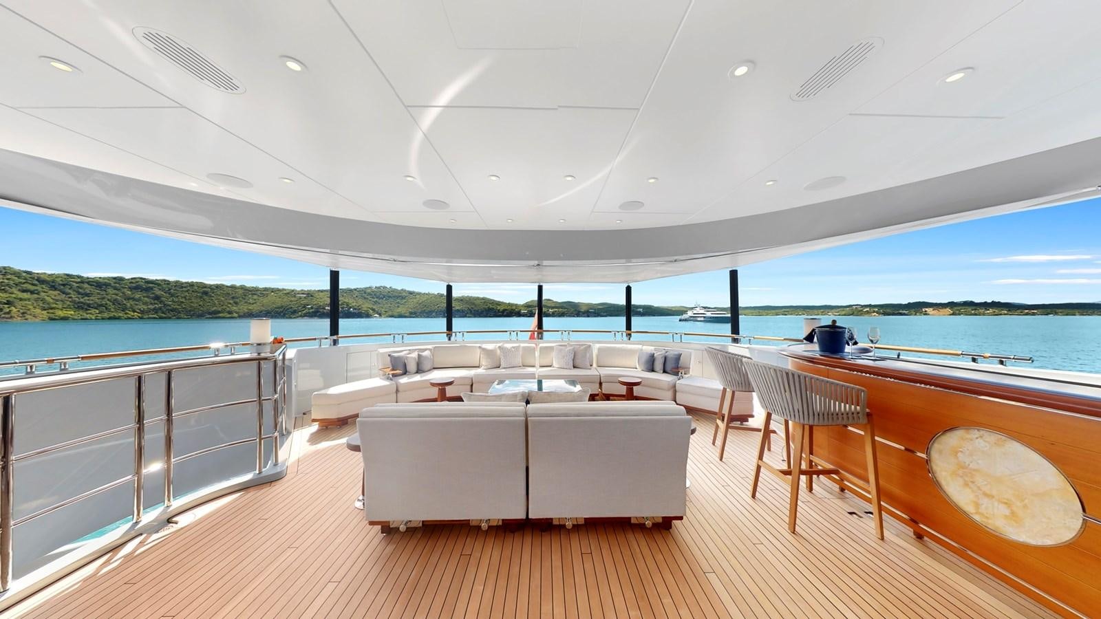 a room with a couch and a table and chairs aboard AFTER YOU Yacht for Sale