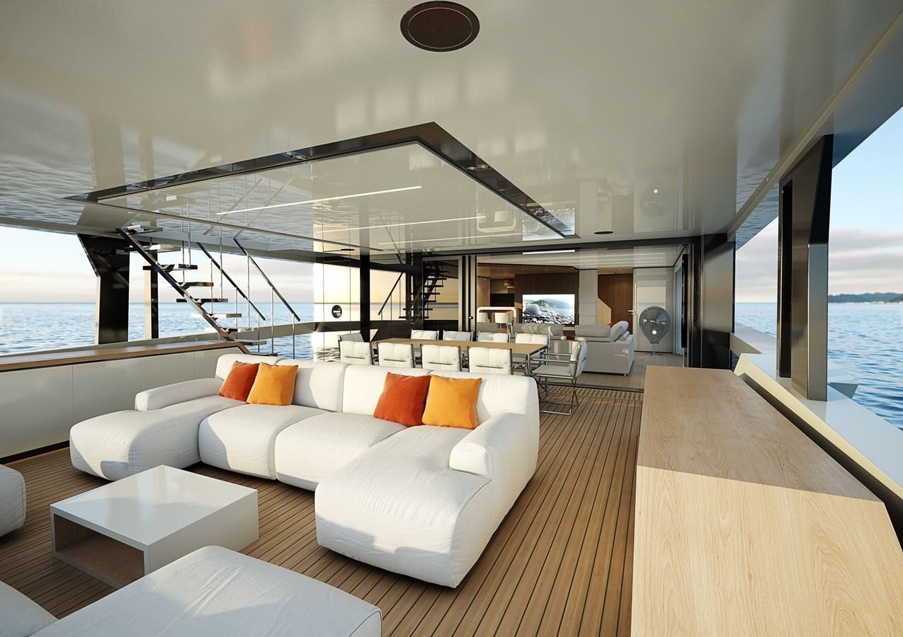 a modern living room with a large glass wall aboard TRIBALE YACHTS Yacht for Sale