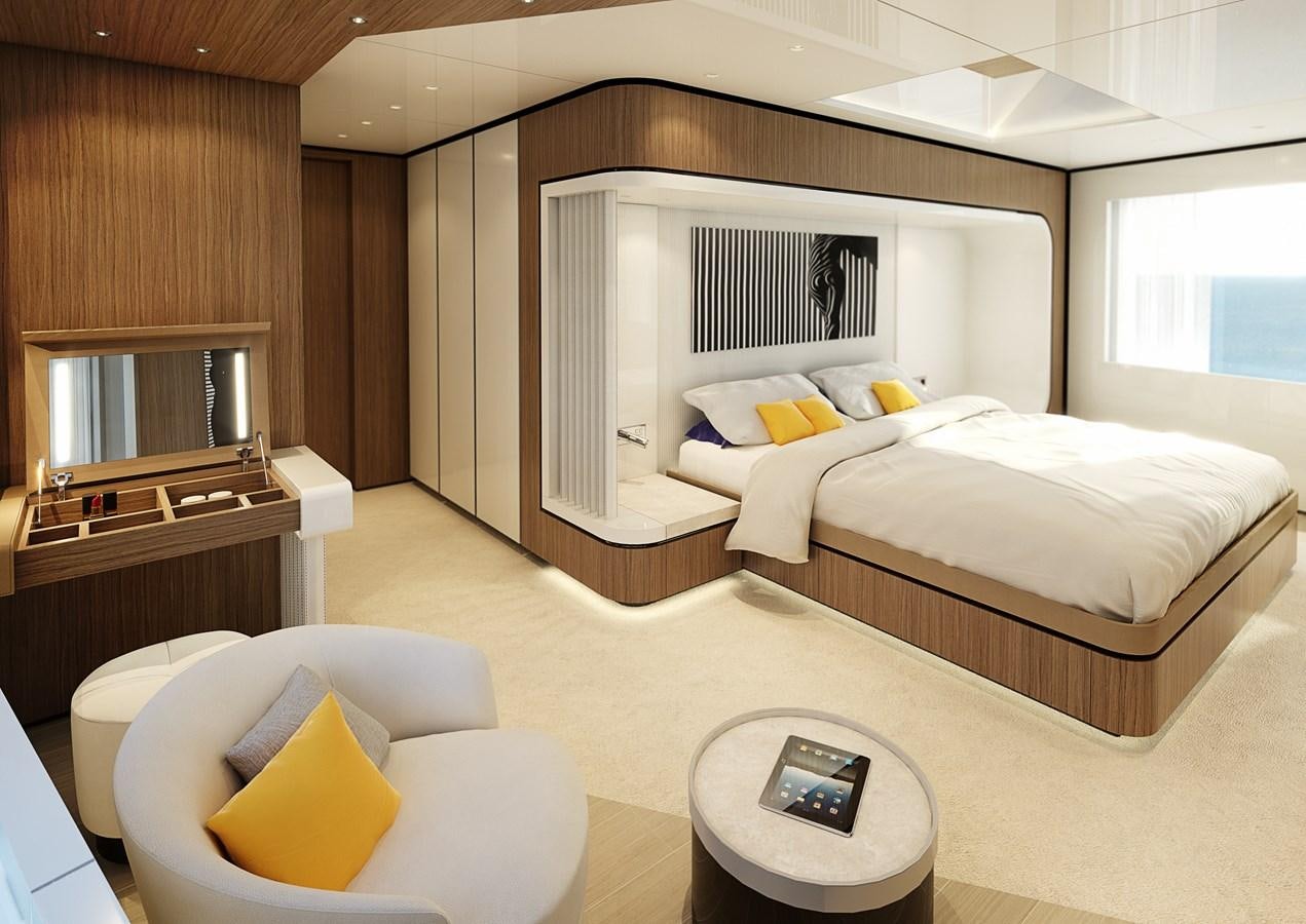a room with a bed and a chair aboard TRIBALE YACHTS Yacht for Sale