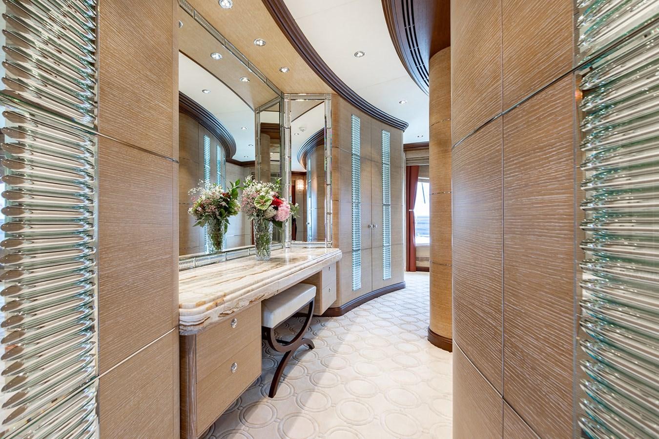 a room with a table and chairs aboard QUEEN MAVIA Yacht for Sale