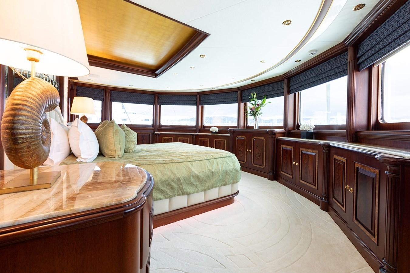 a bedroom with a couple of beds aboard QUEEN MAVIA Yacht for Sale
