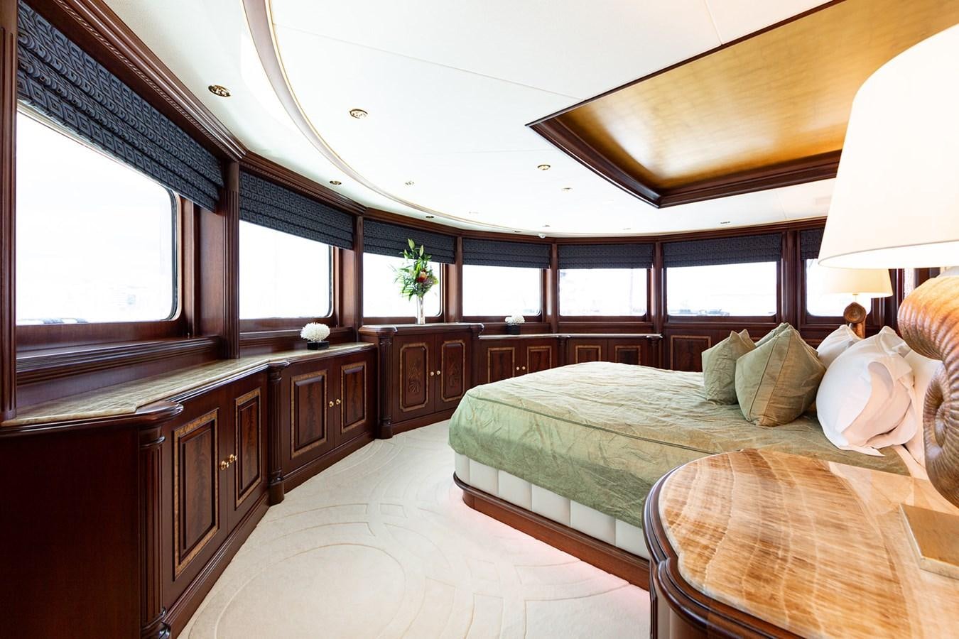a bedroom with a large bed aboard QUEEN MAVIA Yacht for Sale