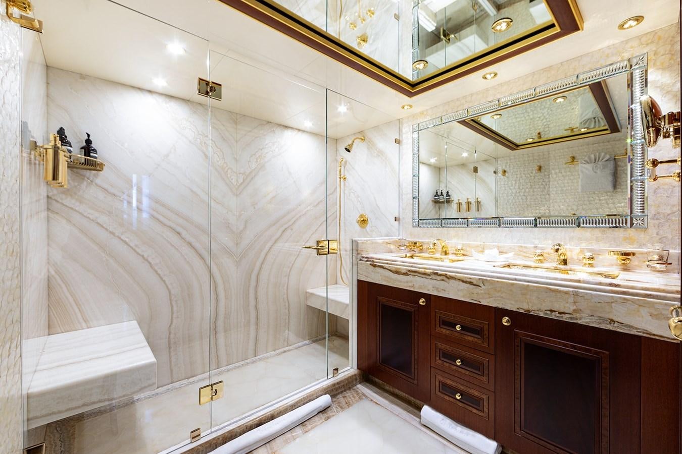 a bathroom with a large mirror aboard QUEEN MAVIA Yacht for Sale