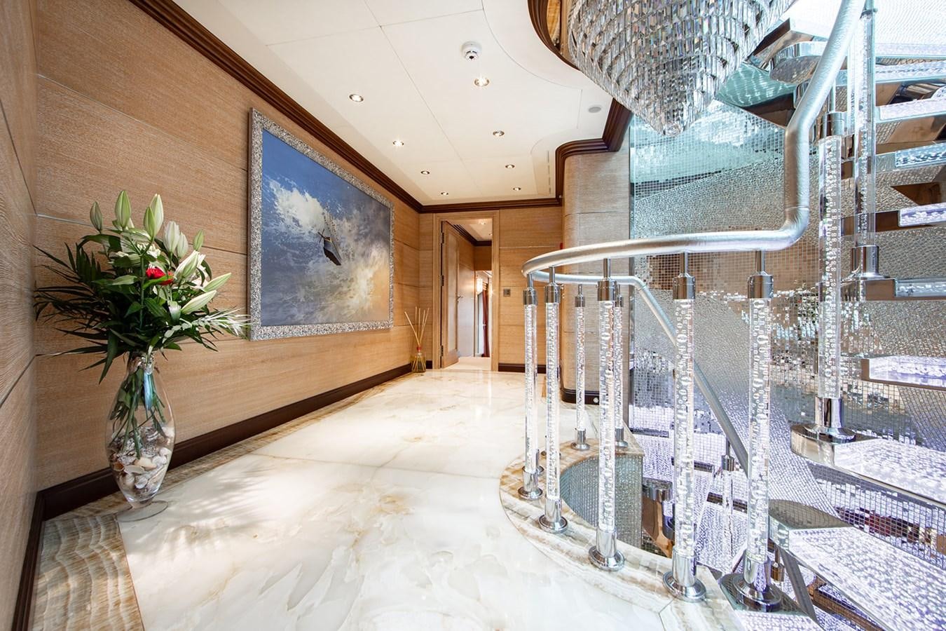 a room with a table and chairs aboard QUEEN MAVIA Yacht for Sale