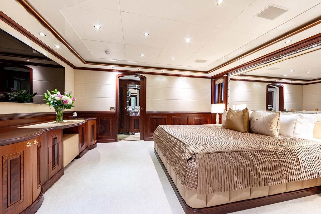 a large bedroom with a large bed aboard QUEEN MAVIA Yacht for Sale
