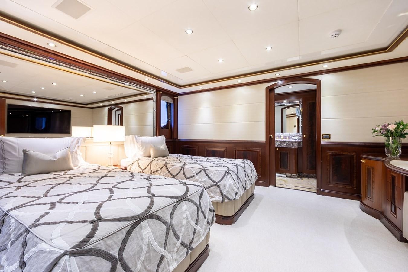 a room with two beds aboard QUEEN MAVIA Yacht for Sale
