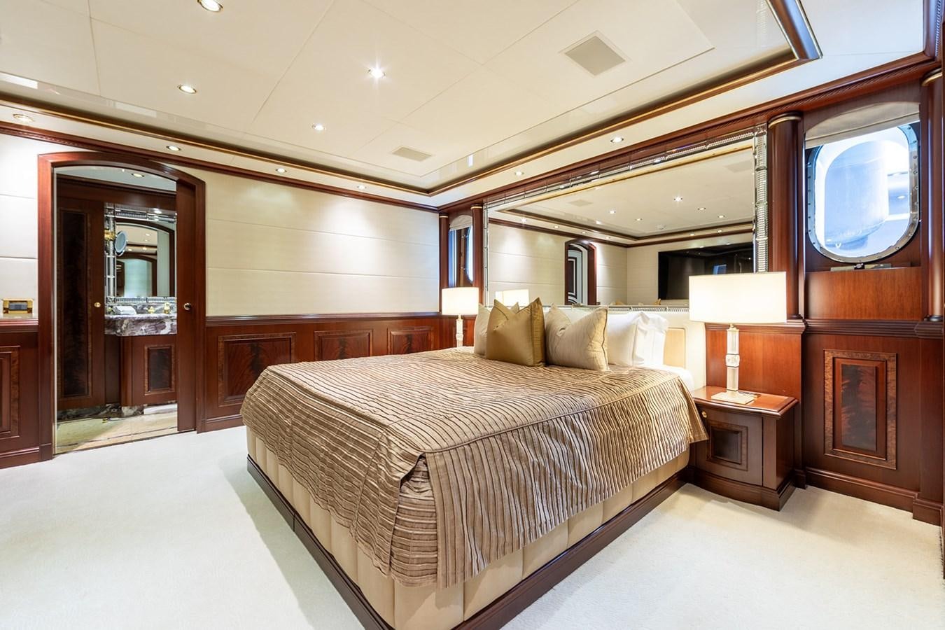 a large bedroom with a large bed aboard QUEEN MAVIA Yacht for Sale