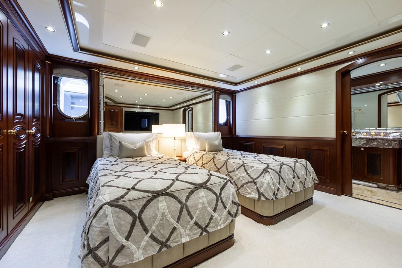 a room with a couple of beds aboard QUEEN MAVIA Yacht for Sale